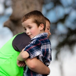 boys hugging each other